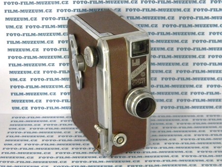 Filmová kamera De Jur Embassy. Výrobce: DeJur-Amsco Corp. Rok výroby: 1949. Objektiv: Wollensak DeJur 13mm f/1.9 Cine Raptor. Snímací frekvence: 12, 16, 24, 32, 48, 64. Vyrobena ze slitiny na bázi hliníku. Pohon perem. Formát-2x8mm.