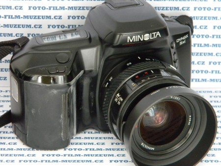 AF zrcadlovka střední třídy uvedená v r. 1992. Závěrka lamelová s vertikálním chodem řízená elektronicky s časy 30s.- 1/2000s. + B. Bajonet Minolta A. Měření Cds TTL. Módy P,A,S,M. Série cca. 1obr./sec.